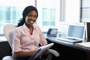 Picture of a female healthcare provider working in an office